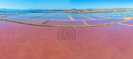 Panoramic View from above of Pink lake in San Pedro del Pinatar city, Spain Europe. San Pedro Salt Flats. Aerial view Horizontal banner