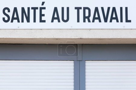 Health at work sign on a wall called sante au travail in French language