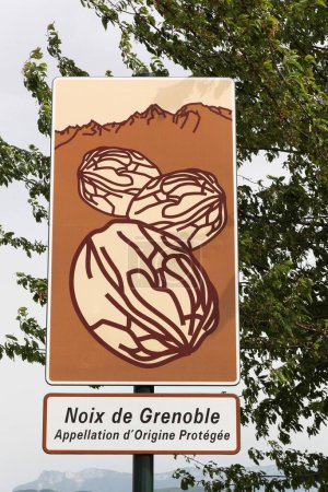 Touristic road sign indicating walnuts from Grenoble in the area
