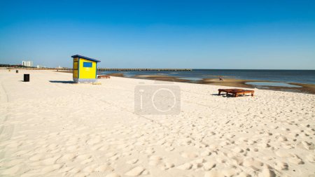 Photo for Gulf coast beach in Biloxi, Mississippi with water tricycles and lounge chairs. - Royalty Free Image