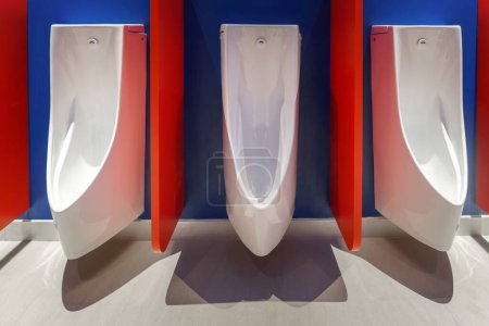 Photo for Man toilet bowl in a spotless public restroom scene reflects modern design, emphasizing cleanliness and comfort. - Royalty Free Image
