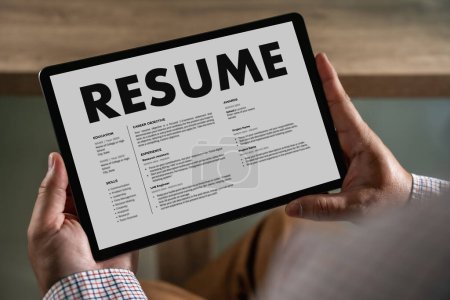 Photo for Businessmen Reading Resumes for a new job use laptops and CVs in the office. Applicant searching for new work Human resource interview, work resume, document resource - Royalty Free Image