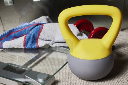 Photo for Kettlebell. Fitness objects, kettlebell, dumbbell, towel and a scale - Royalty Free Image