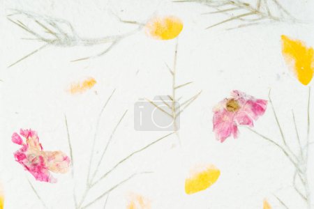 Photo for Handmade recycled flower and leaf paper background. - Royalty Free Image