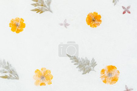 Photo for Handmade recycled flower and leaf paper background. - Royalty Free Image