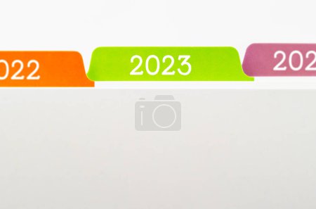 Foto de File folders with selective focus a tab labeled 2023. - Imagen libre de derechos