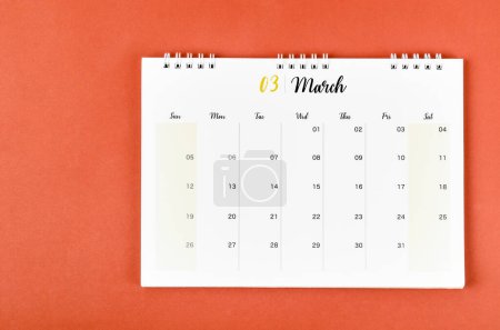 Foto de March 2023 calendar desk for the organizer to plan and reminder on red background. - Imagen libre de derechos
