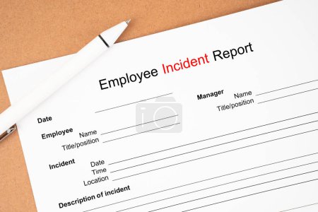Photo for Template of an Employee incident report form document and and pen on wooden background. - Royalty Free Image