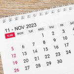November 2023 desk calendar for 2023 on wooden background.