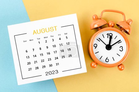 August 2023 Monthly calendar for 2023 year with alarm clock on beautiful background.