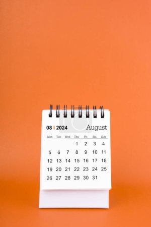 Photo for Vertical of August 2024 table calendar on orange color background. - Royalty Free Image