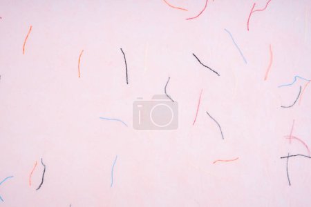 The Soft pink colour mulberry paper texture background.