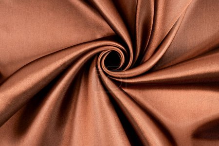 Brauner Hintergrund Luxustuch oder wellenförmige Falten aus Grunge-Seide Textur.