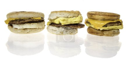Photo for Winneconne, WI - 20 February 2024: A package of McDonalds sausage, egg, and cheese Mcgriddles, McMuffing and biscuit breakfast sandwiches on an isolated background. - Royalty Free Image