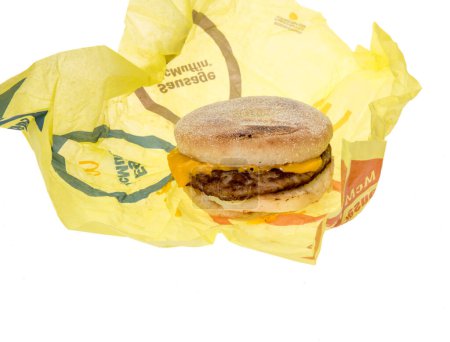 Photo for Winneconne, WI - 20 February 2024: A package of McDonalds sausage, egg, and cheese Mcmuffin on a wrapper an isolated background. - Royalty Free Image