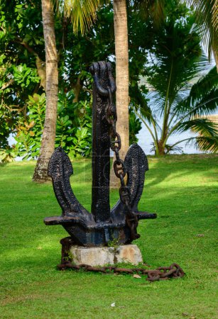 Heavy metal anchor exhibit on the grass field Galle fort.