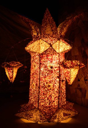 Tall Vesak lantern decorated or completely covered with onion peels, Sri lankan vesak festival celebrations.