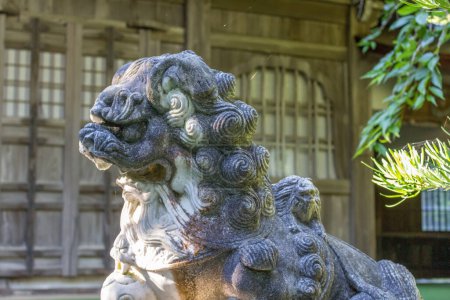 Photo for Komainu, or lion-dog, statue at imohoritougorou jinja, Kanazawa, Japan. - Royalty Free Image
