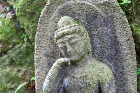 Foto de Stone statues of Ojizou san, protector of children, Hanibe caves, Ishikawa, Japan. - Imagen libre de derechos