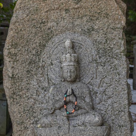 Statue of Buddha with beads, Kanazawa, Japan