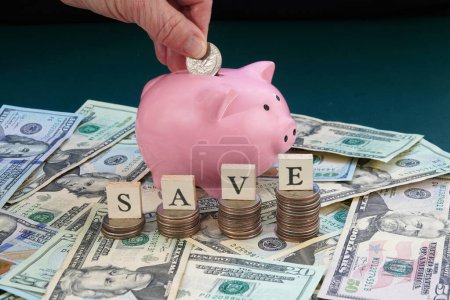 Foto de Piggy Bank with Dollars and Coins. Concepts of saving, personal finances and economy. - Imagen libre de derechos