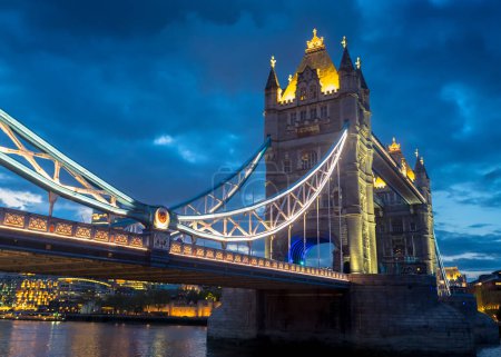 Photo for The famous landmark of London, the Tower Bridge is lit beautifully on a spring evening. - Royalty Free Image