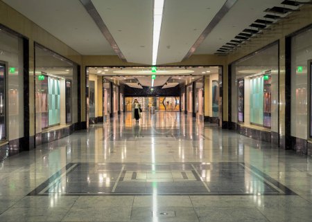 Photo for A woman is walking in a tunnel under a large shopping center. The tunnel interior looks like a palace. - Royalty Free Image