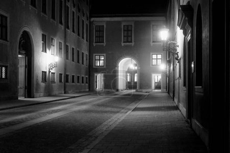 Photo for An old courtyard at Munich, Germany on a spring night. The old lanterns light the scenery beautifully. - Royalty Free Image