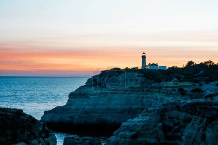 The wild and scenic limestone coast of the Algarve, Portugal, with the Alfanzina Lighthouse. Between Benagil and Alfanzina.