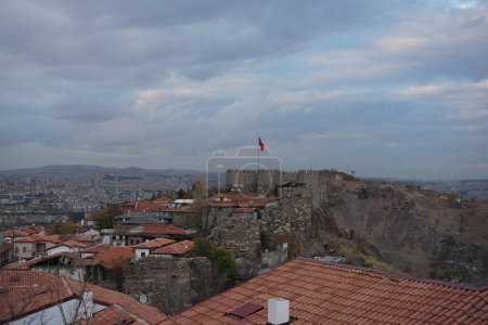 Photo for Ankara Castle on blue sky background with flag waving under the moon - Royalty Free Image