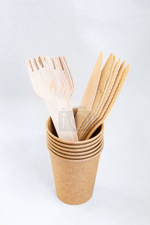 Photo for Cardboard disposable cup for coffee. Eco friendly food containers from paper. Spoons and knifes. Plastic free - Royalty Free Image
