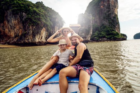 Photo for Family travel. Happy mom, dad and son on a boat trip in Thailand, Asia. Tourists. Travelers. - Royalty Free Image