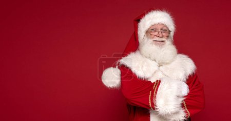 Photo for Christmas are coming! Real Santa Claus smiling, posing in studio. - Royalty Free Image