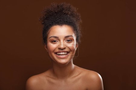 Photo for Beauty portrait of african american woman with amazing natural toothy smile on brown background. Smiling beautiful afro girl. Happiness. - Royalty Free Image