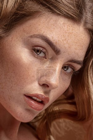 Photo for Beauty closeup portrait of charming ginger woman with natural freckles. Girl looking at camera. - Royalty Free Image