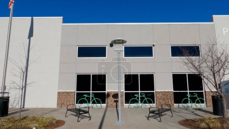 Photo for Grovetown, Ga USA - 12 25 22: Walmart grocery store exterior clear blue sky green bike racks - Royalty Free Image