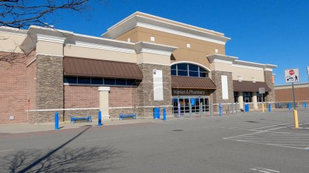 Photo for Grovetown, Ga USA - 12 25 22: Walmart grocery store exterior clear blue sky orange store pickup sign - Royalty Free Image