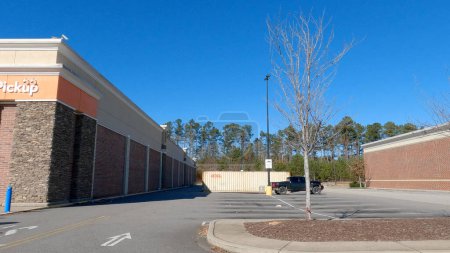 Photo for Grovetown, Ga USA - 12 25 22: Walmart supercenter exterior clear blue sky side of store - Royalty Free Image