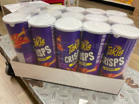 Photo for Grovetown, Ga USA - 03 10 23: Grocery store Takis crisps canister full case on cart - Royalty Free Image
