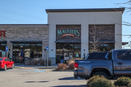 Photo for Augusta, Ga USA - 01 28 21: McAlisters Deli front entrance and parked cars with people - Royalty Free Image