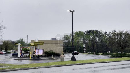 Photo for Grovetown, Ga USA - McDonalds fast food restaurant exterior rainy day - Royalty Free Image