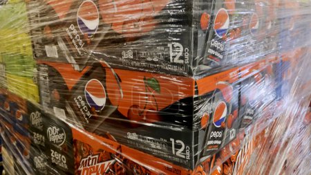 Photo for Grovetown, Ga USA - 03 15 23: Food Lion grocery store interior Pepsi Cola Co. variety soda 12 packs plastic wrapped delivery pallet - Royalty Free Image