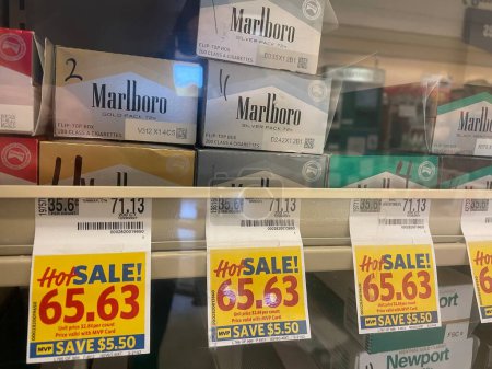 Photo for Grovetown, Ga USA - 04 30 22: Food Lion grocery store cigarette carton prices Marlboro - Royalty Free Image