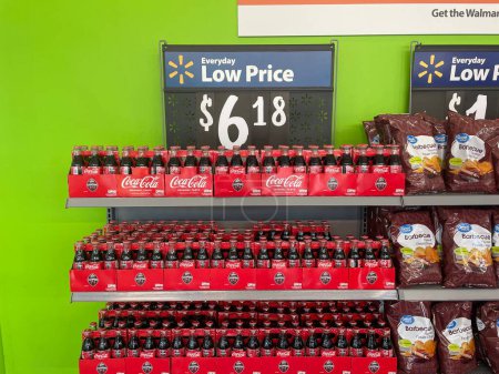 Photo for Grovetown, Ga USA - 09 08 23: Walmart grocery store Wall of value Coke 6 packs classic bottles - Royalty Free Image