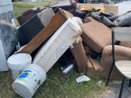 Photo for Grovetown, Ga USA - 09 08 23: Furniture piled up from eviction on curb - Royalty Free Image