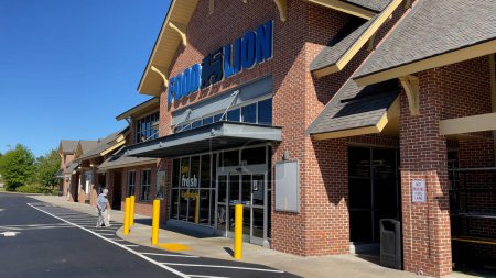 Photo for Grovetown, Ga USA - 02 16 22: Food lion Grocery store 2022 exterior senior wearing face mask - Royalty Free Image