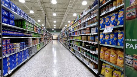 Photo for Lakeland, Fla USA - 12 16 23: Publix grocery store interior looking down drink aisle - Royalty Free Image