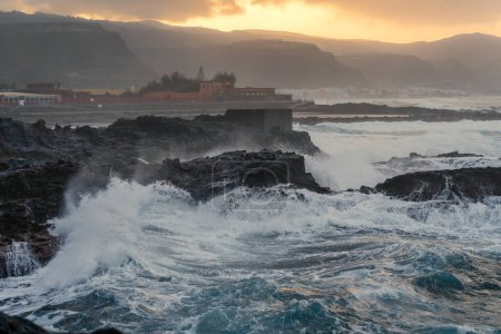 Photo for Seascape. Big waves in El Puertillo at sunset. Arucas. Gran Canaria - Royalty Free Image