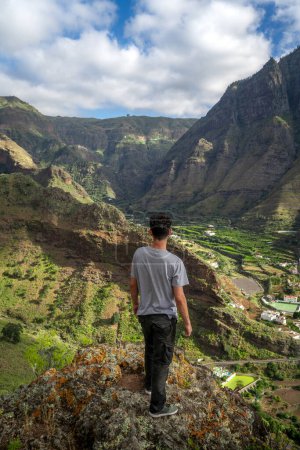 Young man contemplates the landscape. Agaete Valley. Gran Canaria. Canary Islands