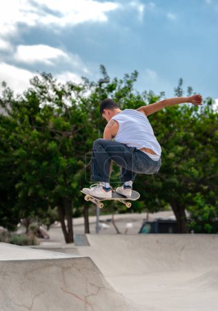 Photo for Young man jumping a ramp with his skateboard - Royalty Free Image